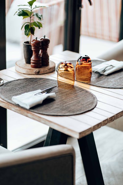 Free Chic table setting with earthy tones and elegant decor, perfect for a cozy dining atmosphere. Stock Photo