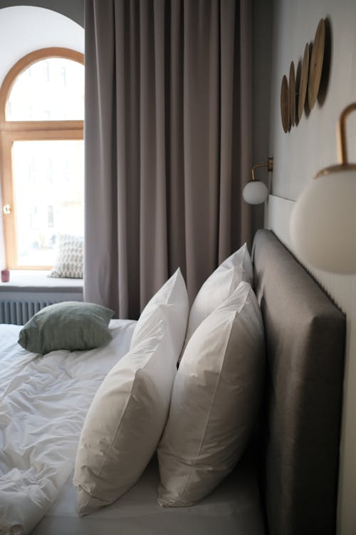 Free White Bed Linen Near White Window Curtain Stock Photo