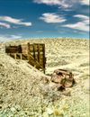 Brown Wooden Fence on White Sand Under Blue Sky