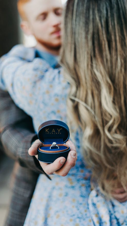 Man Holding Engagement Ring