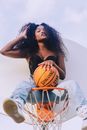 Woman in Black Brassiere Holding Basketball