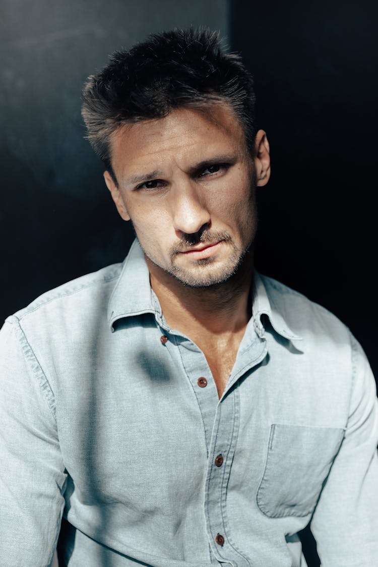 Portrait Of Man In Blue Shirt