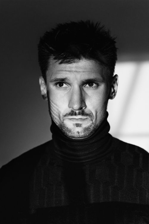Free Black and white close-up portrait of a man in a turtleneck. Stock Photo