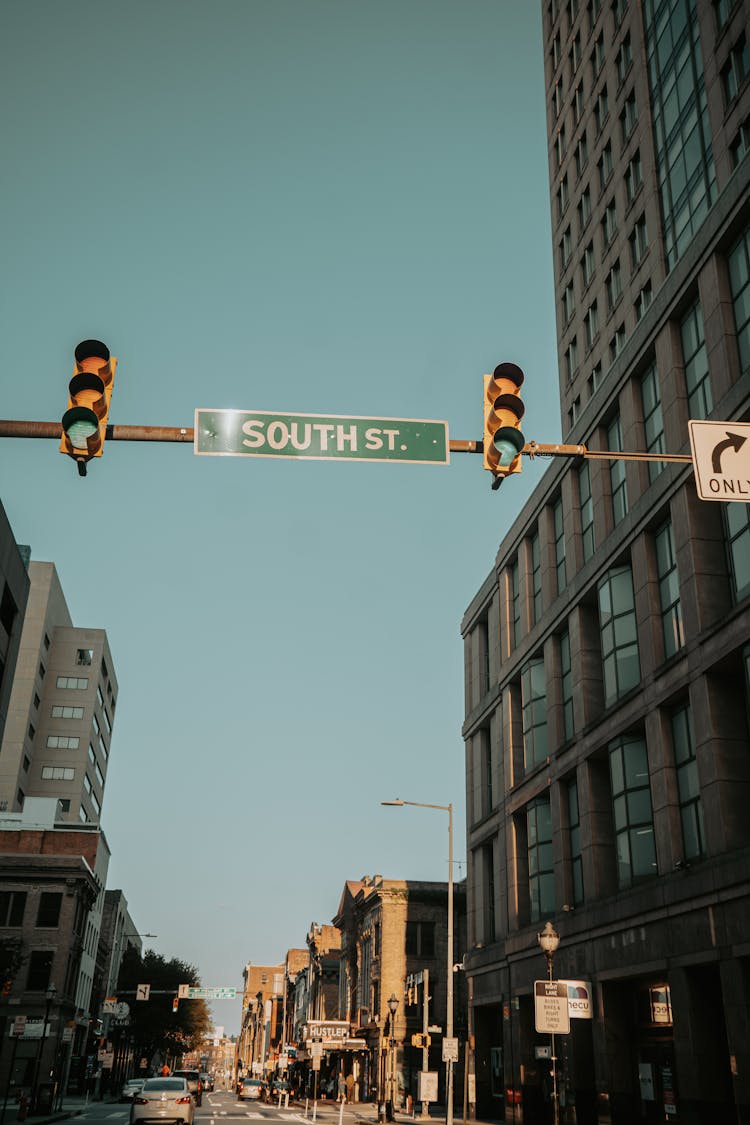 Road Sign And Lights On City Downtown Street