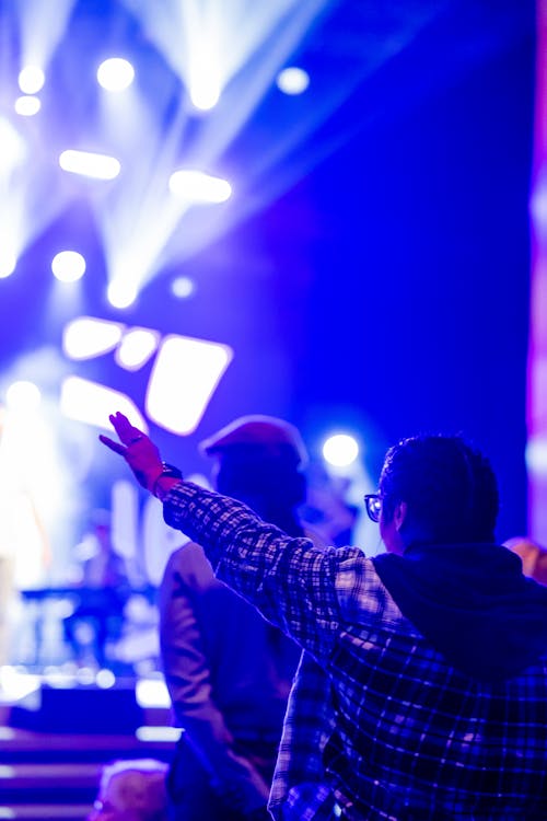 People Dancing on Concert in Club