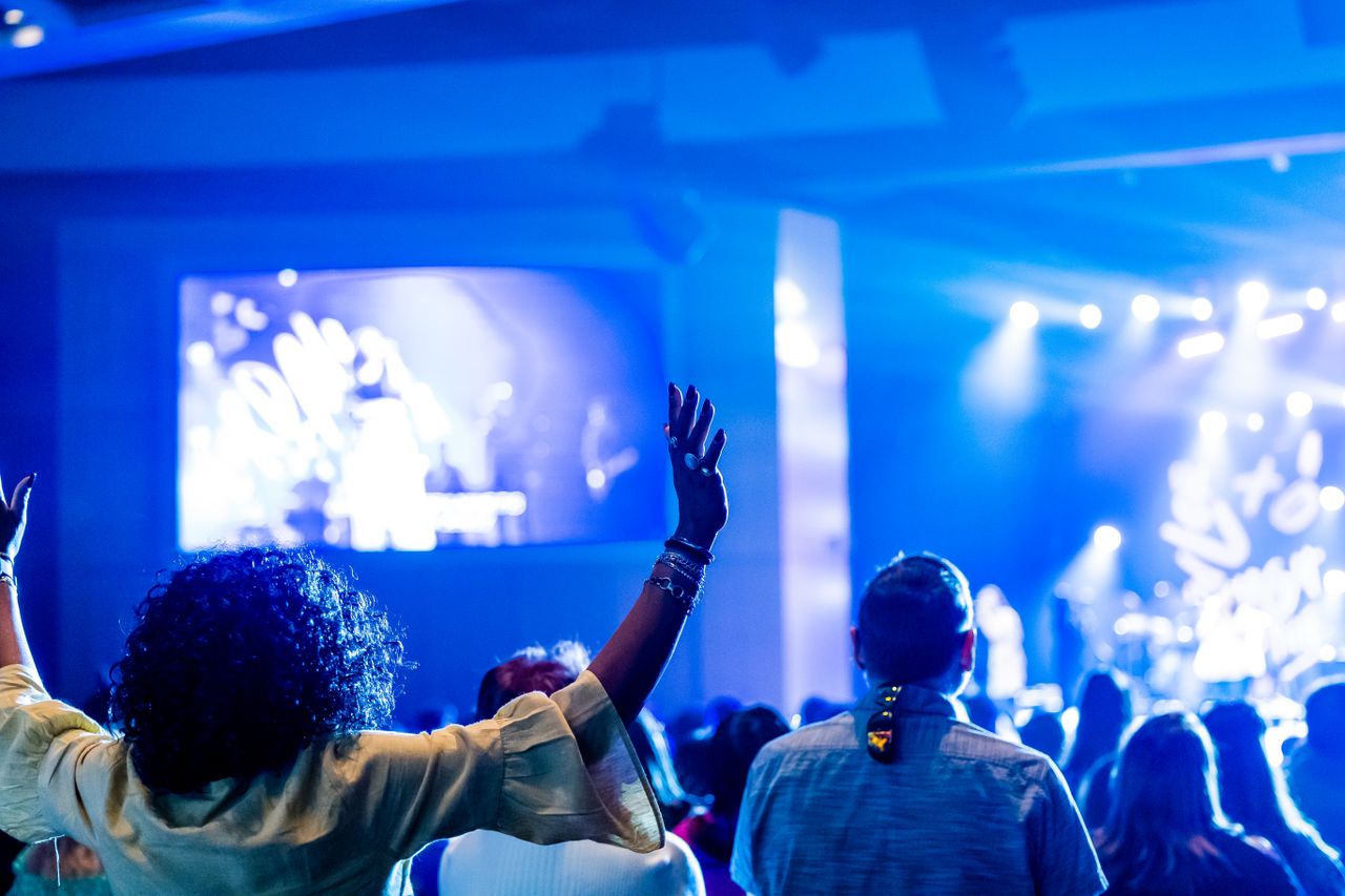 energetic nightclub atmosphere with people enjoying live music and col