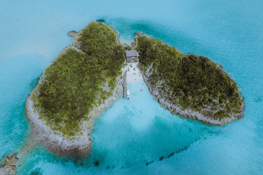 House in Middle of Small Lush Island