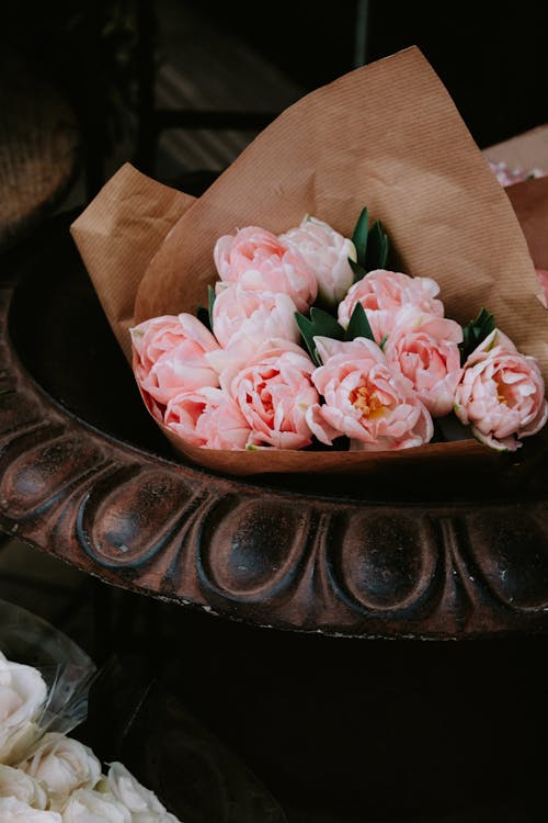 Pink Flowers Wrapped in Brown Paper