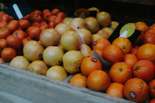 Market Stalls With Fruits Like Oranges And Apples