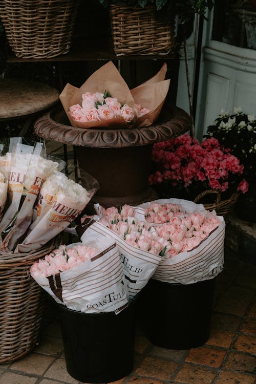 Bouquets Of Pink Roses In Buckets And Baskets