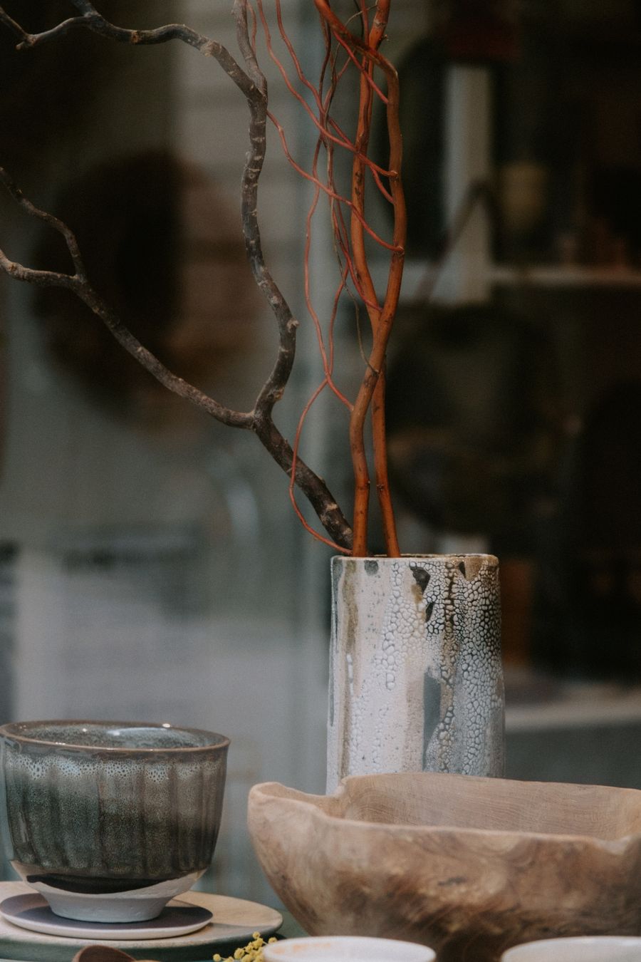 Ember Vessel: wood-fired glazed vase beside a stoneware bowl