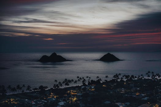 A breathtaking aerial view of the Lanikai Pillbox overlooking the Mokulua Islands during sunrise in Hawaii.