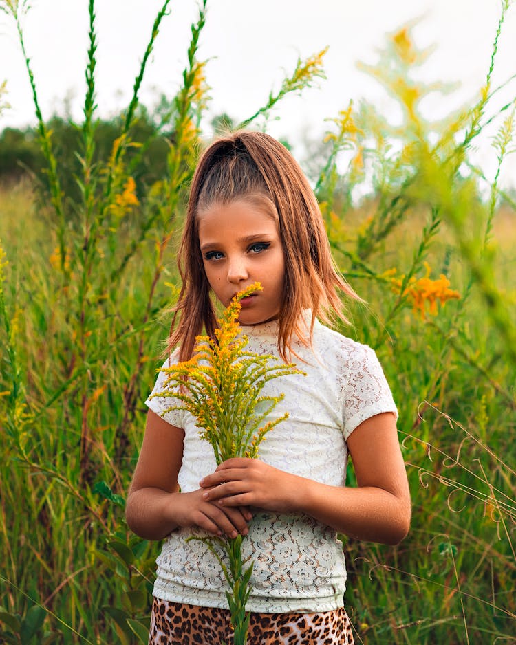 Girl Holding A Plant