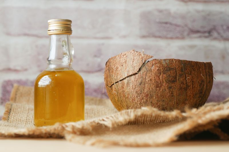 Coconut oil and cloth for natural sticker removal