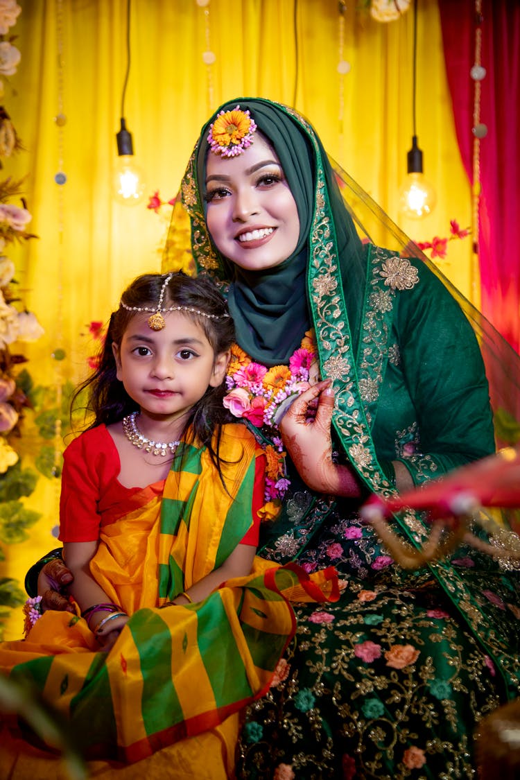 Portrait Of Indian Mother And Daughter In Traditional Clothes