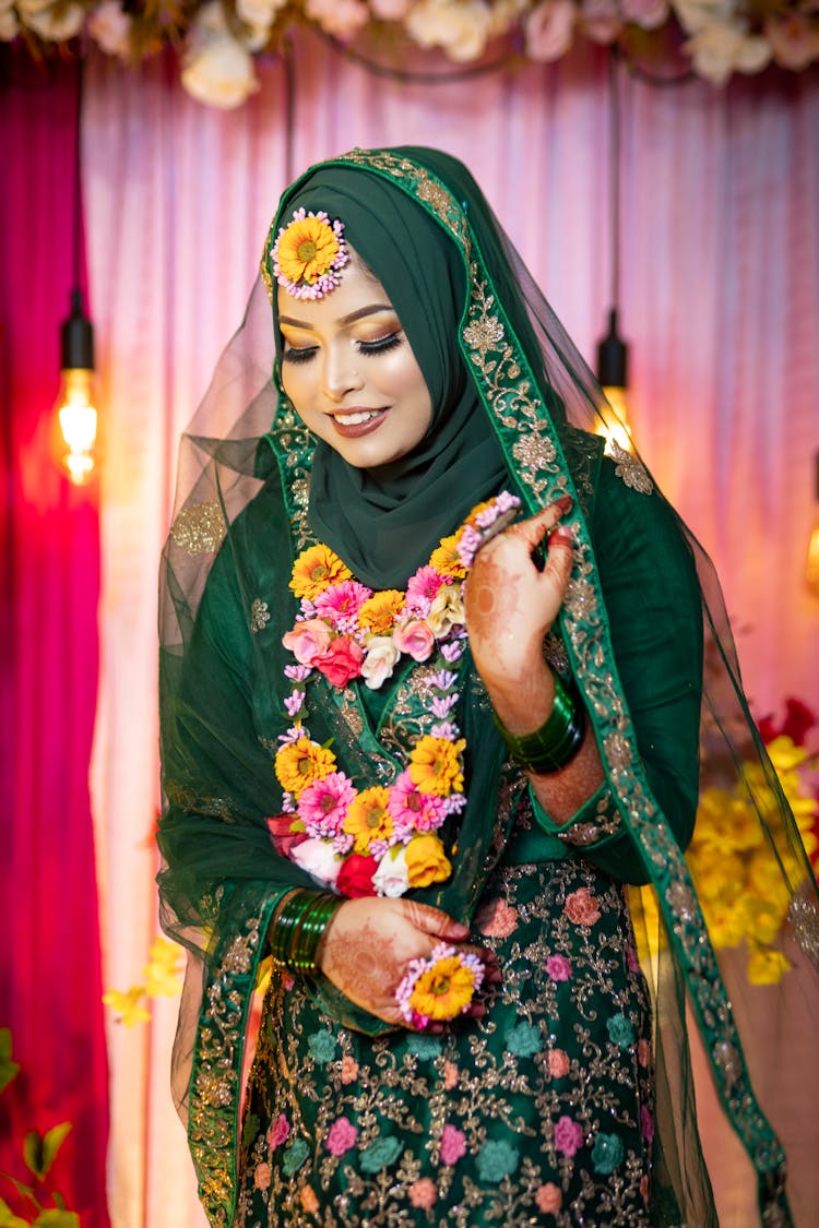 Portrait Of Hijabi Bride Wearing Flower Wreaths