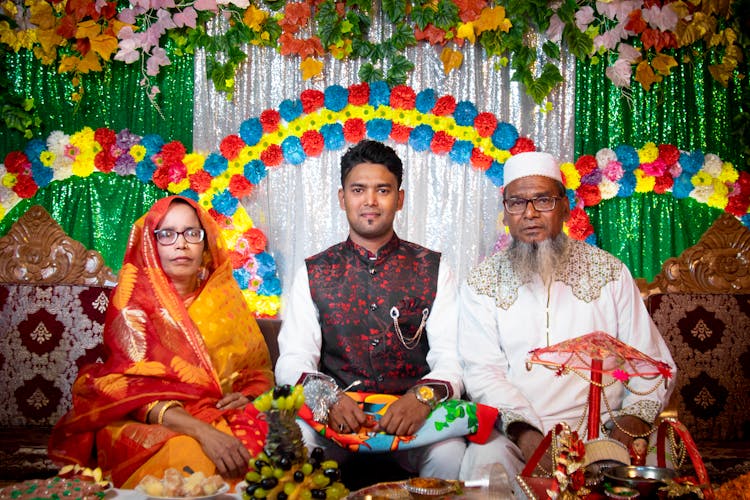 Colorful Family Portrait Of Indian Couple With Their Son