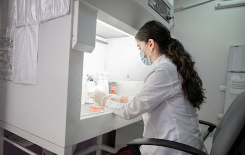 A Woman Wearing a Lab Coat in a Laboratory