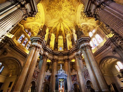 Free Stunning view of a Gothic cathedral's dome and columns from below. Stock Photo