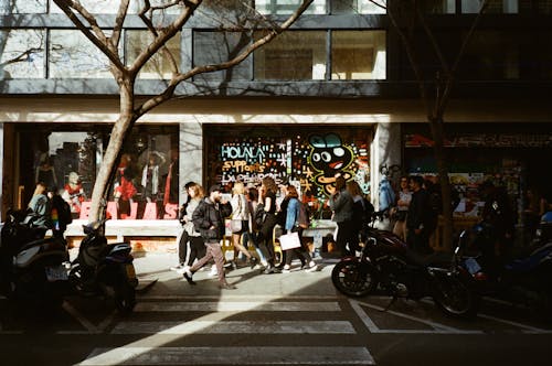 People Walking on a Sidewalk