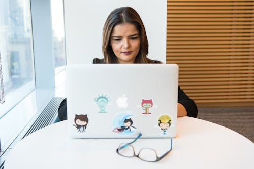 Woman Using Silver Apple Macbook