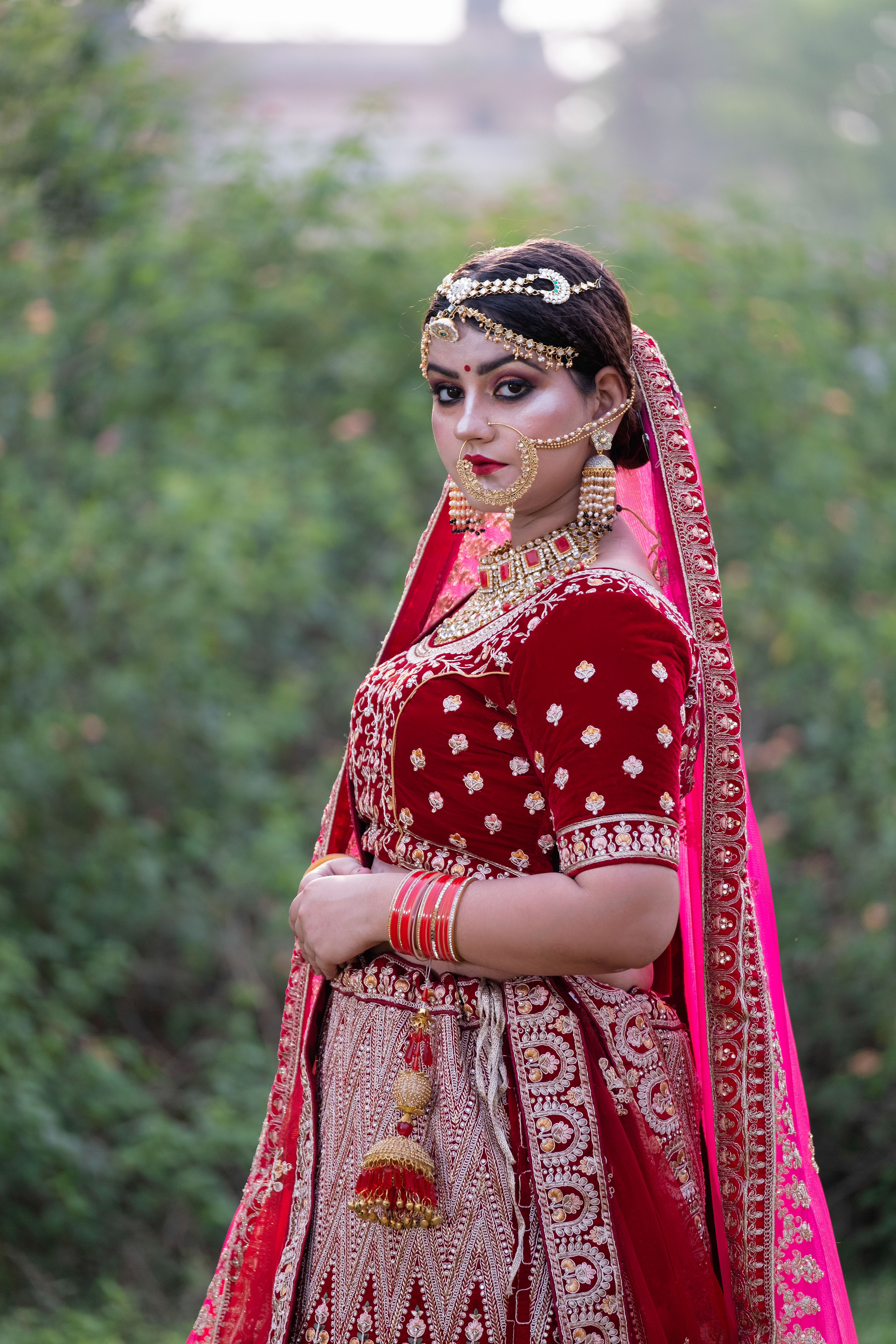 Woman in Traditional Dress Sitting on Grass · Free Stock Photo
