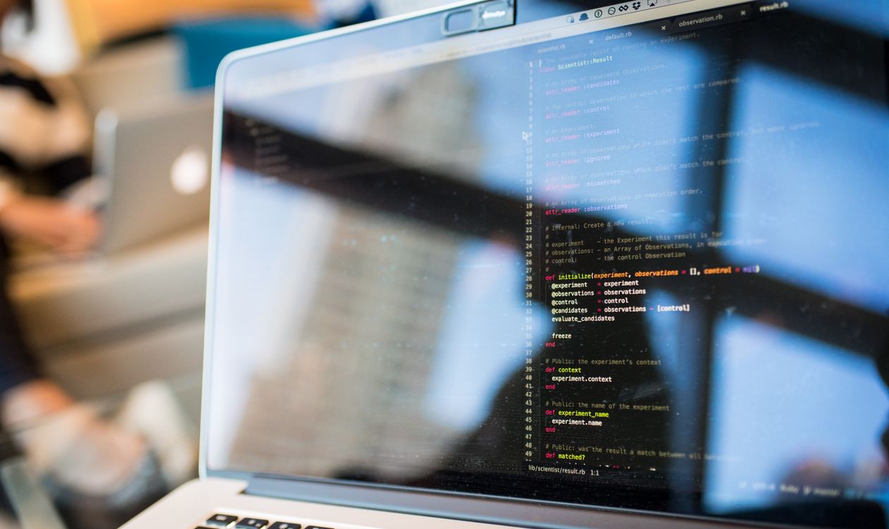Code on a laptop screen, illustrating application development and integration work
