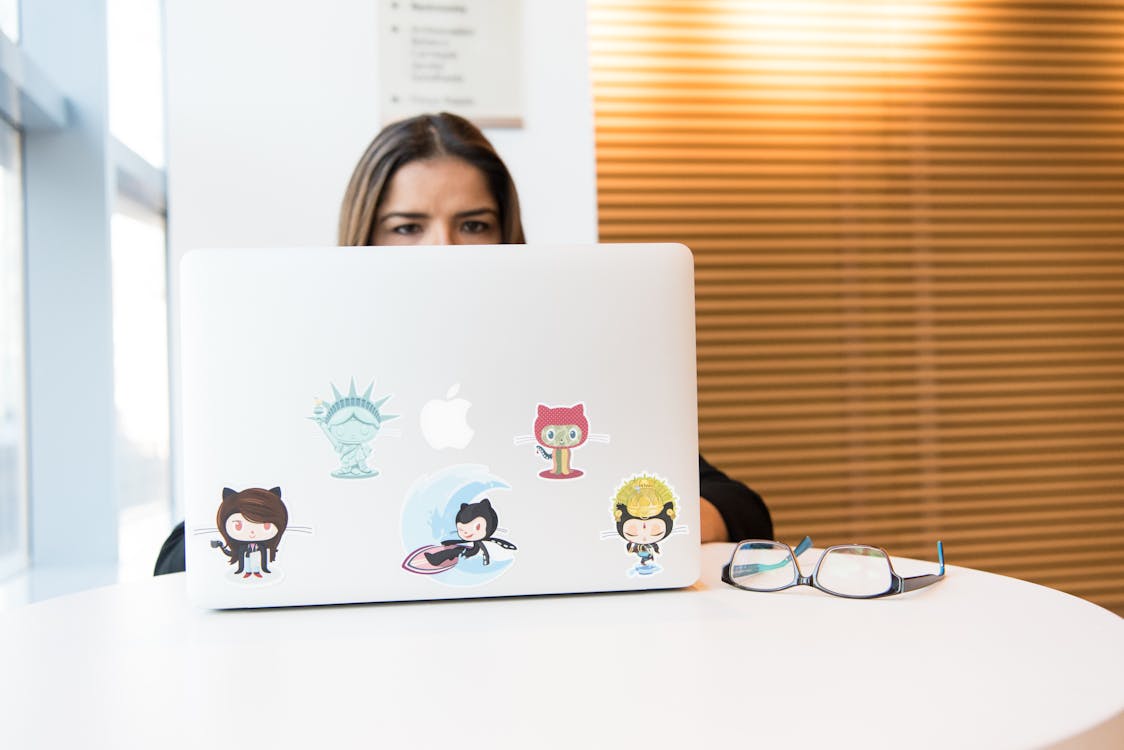 Woman Sitting in Front of Laptop