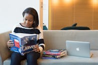Photography of Woman Reading Book