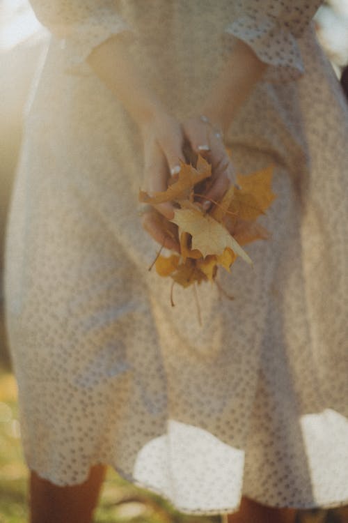 Woman Holding Dried Leaves