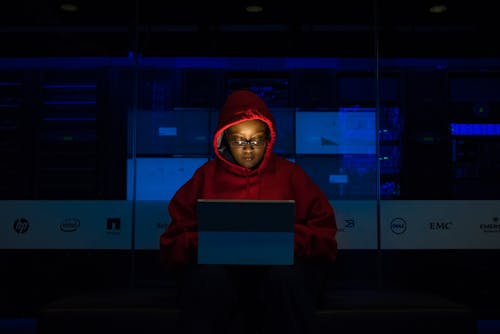 Free Woman Wearing Hooded Pullover Hoodie Facing Tablet Computer Stock Photo