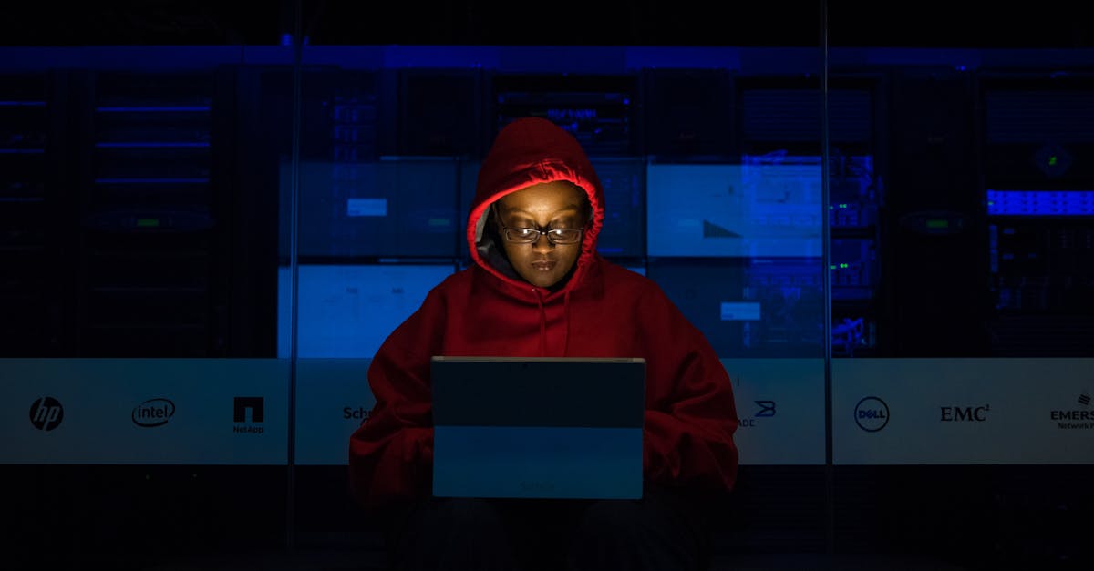 Woman Wearing Hooded Pullover Hoodie Facing Tablet Computer