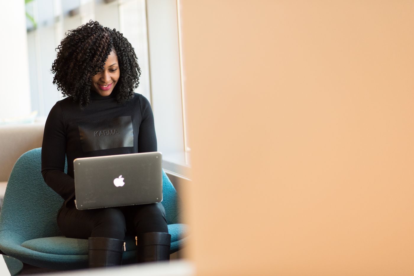 Black woman using a laptop to learn about credit scores