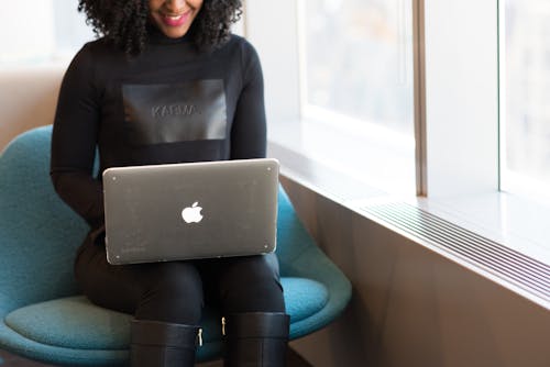 Woman Holding Silver Macbook