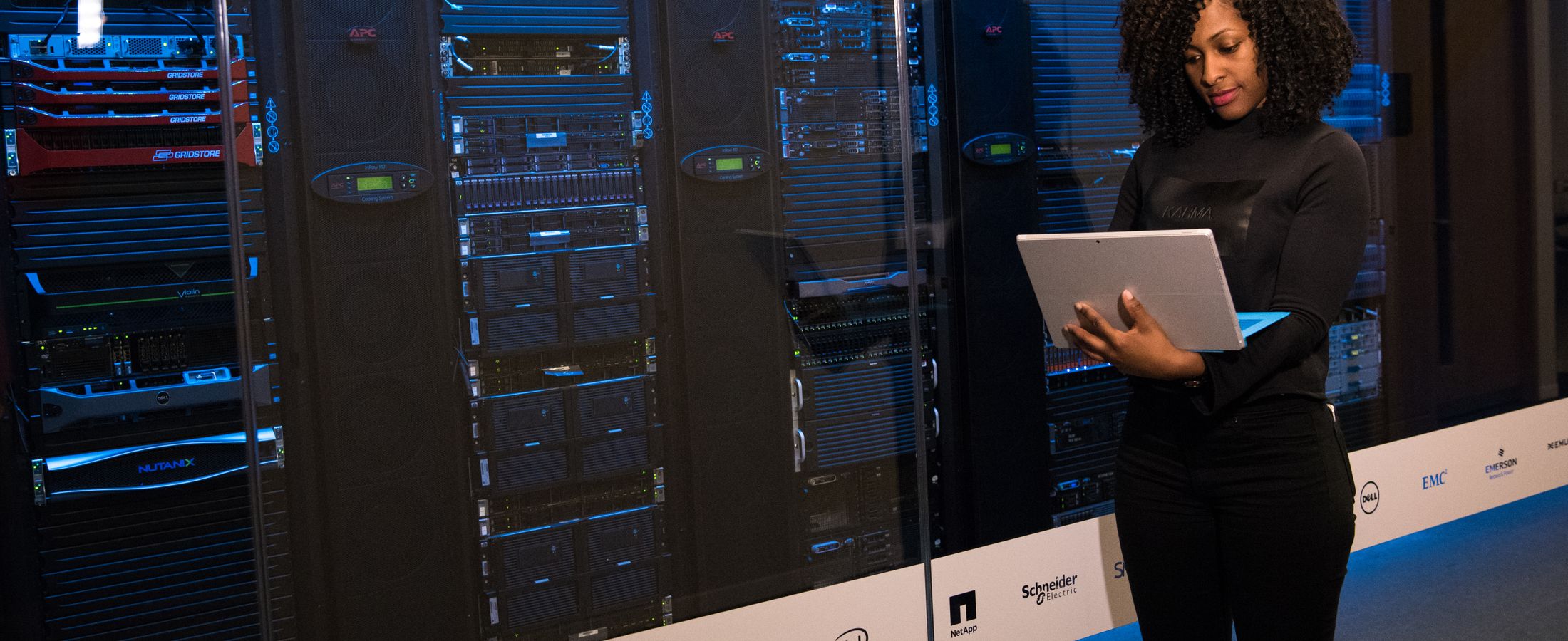 An engineer checking equipment in a server room