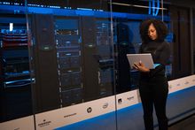 Engineer reviewing infrastructure in a data center