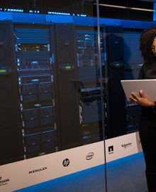 Engineer reviewing infrastructure in a data center