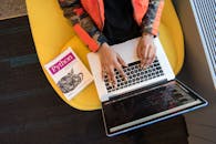 Woman Programming on a Notebook