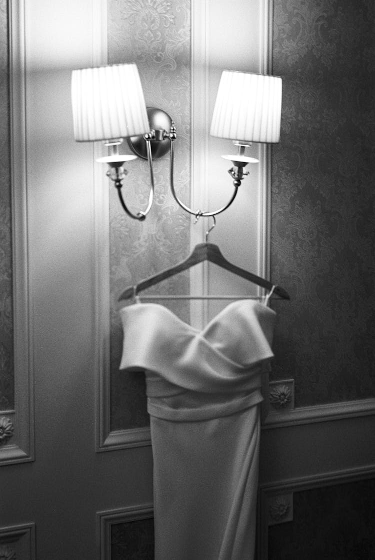 Satin Dress On A Hanger Under The Lamps