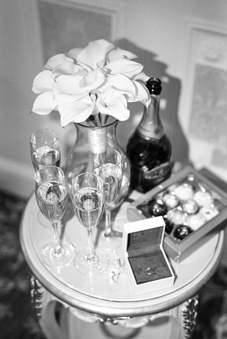 Champagne And Flowers On Table