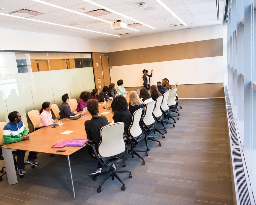Group collaborating around a table in a bright modern conference room