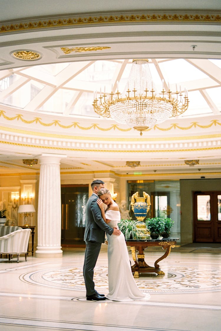 Bride And Groom Hugging In Luxury Hall