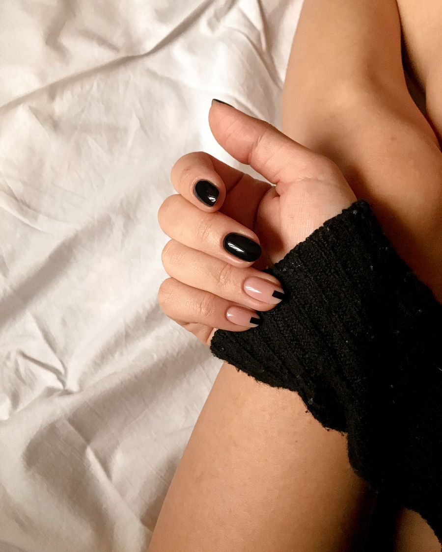 Hush Nail Studio — black almond with soft accent on a sweater