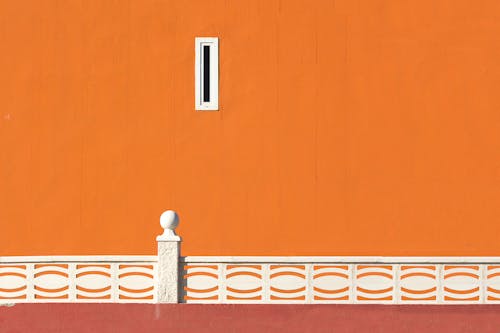 Orange Wall With White Ornaments
