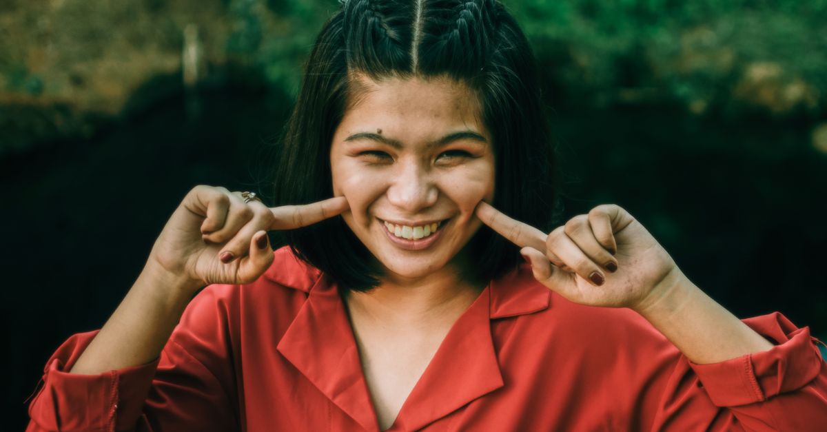 person calmly saying no while smiling, setting a boundary
