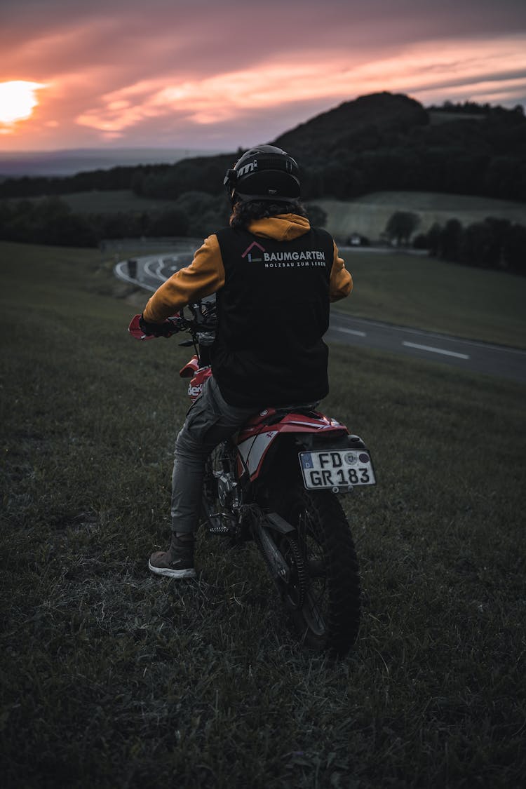 Back Of A Man Sitting On A Motorbike