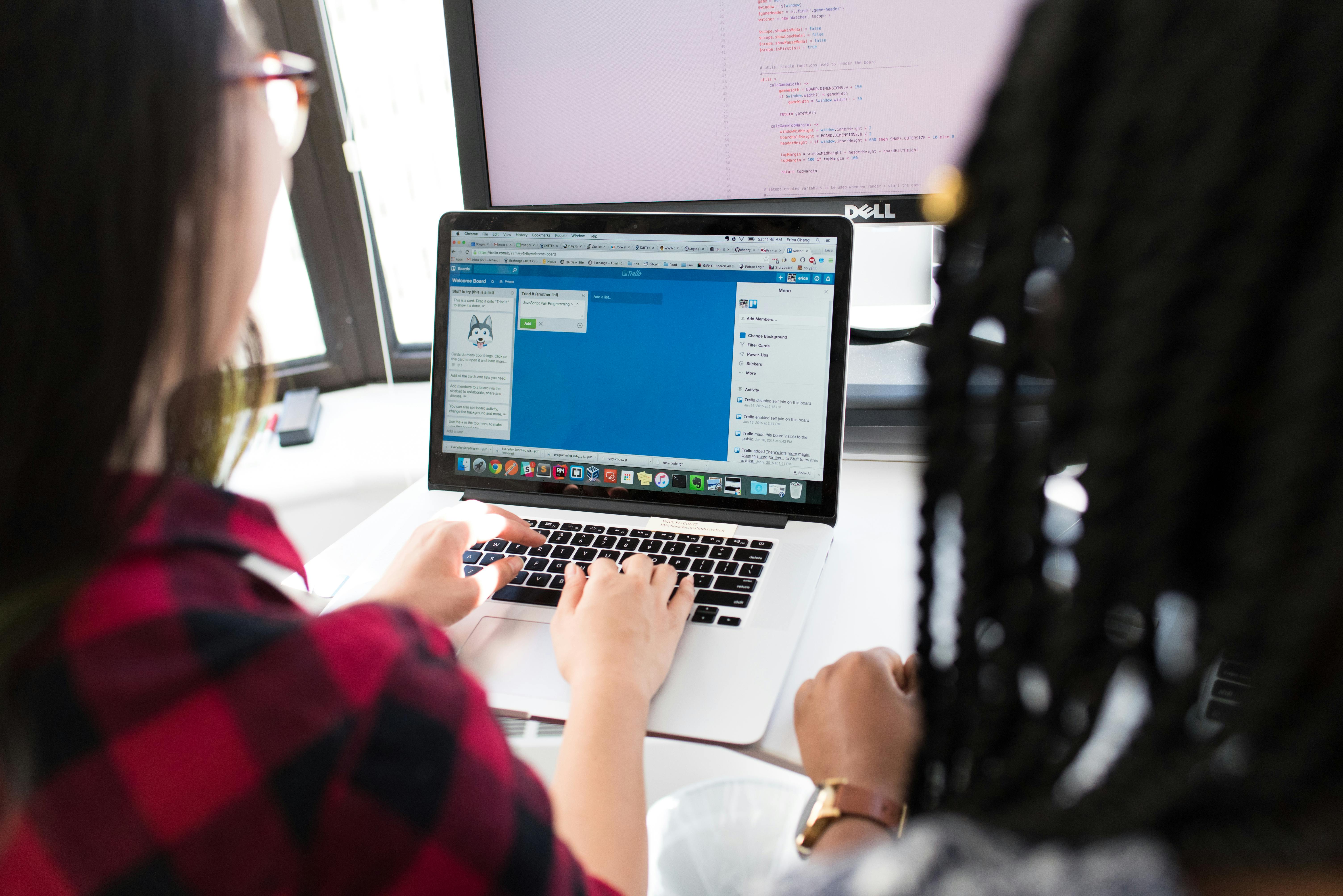 woman using macbook pro