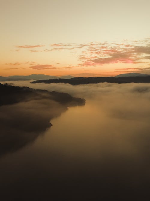 Free Landscape with Mountain and River at Sunset Stock Photo