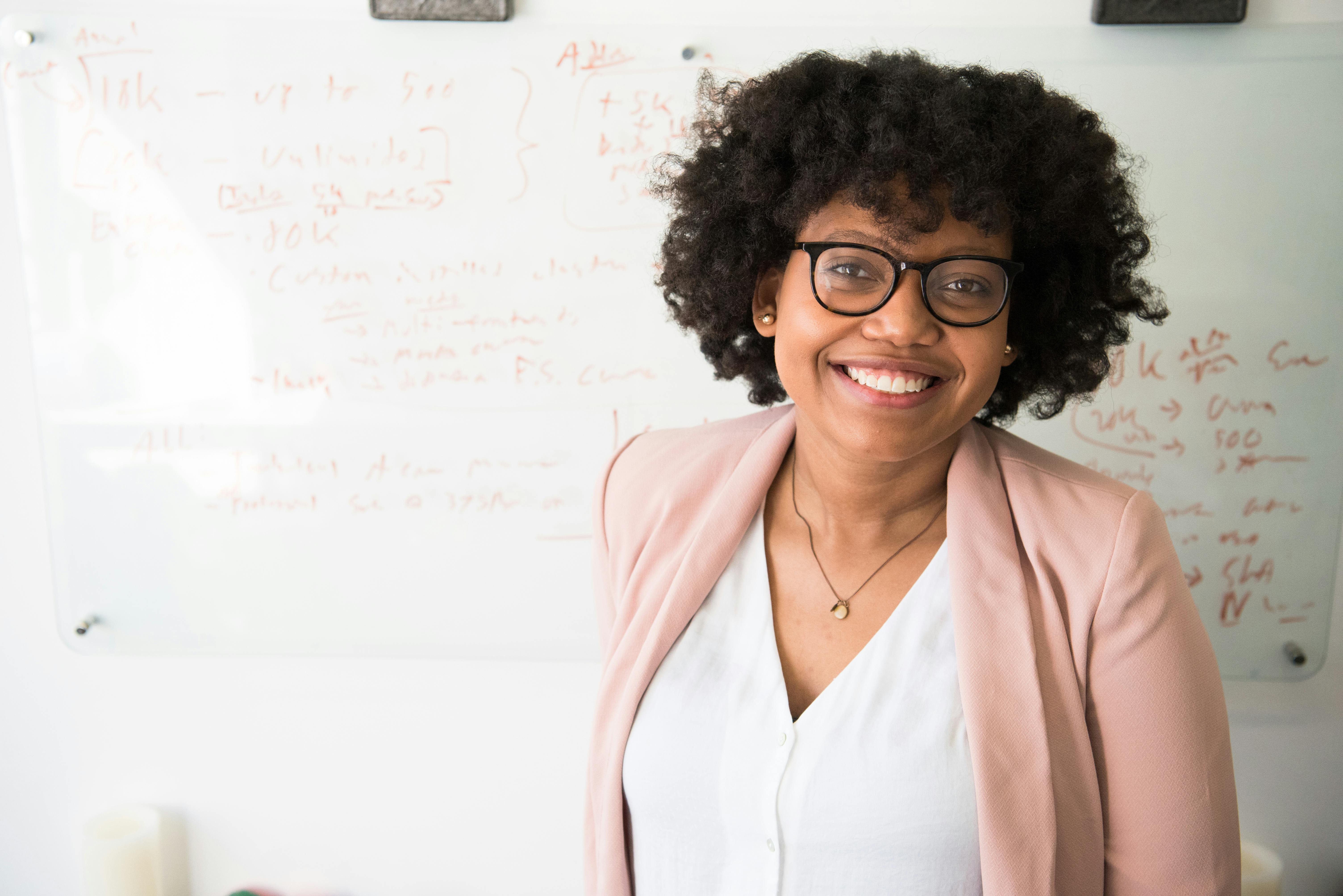 woman standing near whiteboard