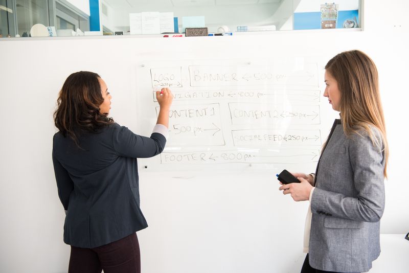 Team working together at desk, no faces visible